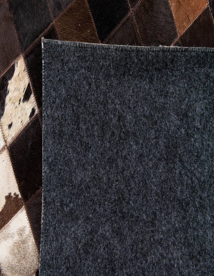 Detail image of  4' 11 x 7' 10 Cowhide Stocks Rug