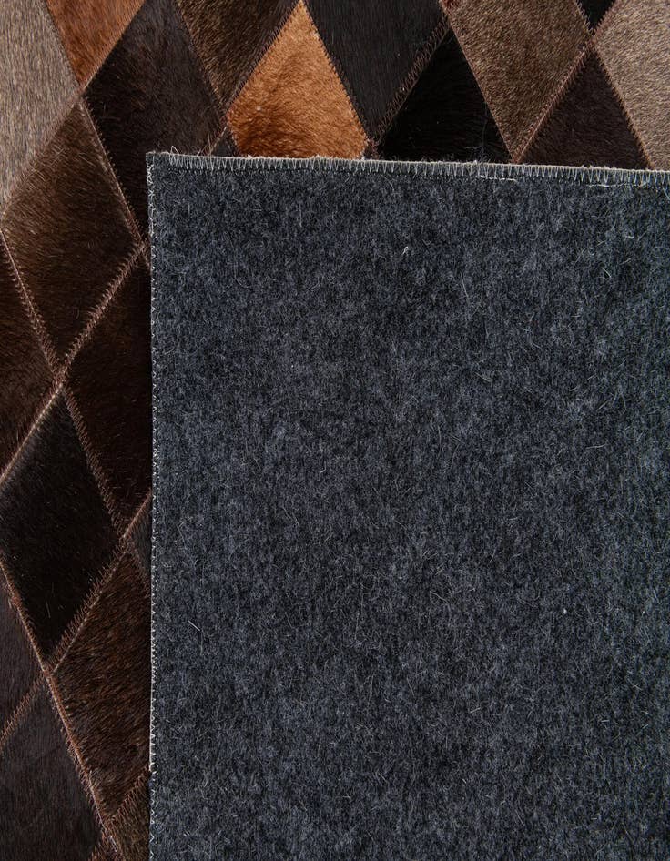 Detail image of  4' 11 x 7' 10 Cowhide Stocks Rug