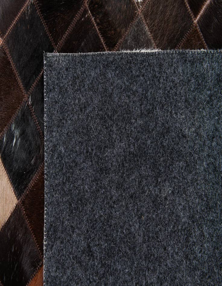 Detail image of  5' x 7' 11 Cowhide Stocks Rug