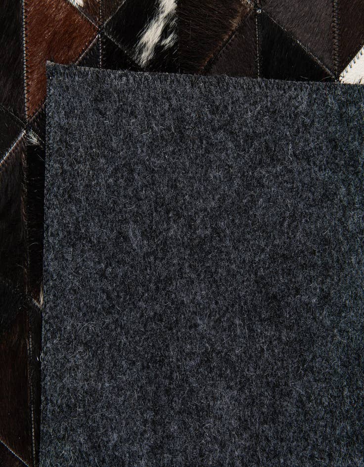 Detail image of  5' 1 x 8' Cowhide Stocks Rug
