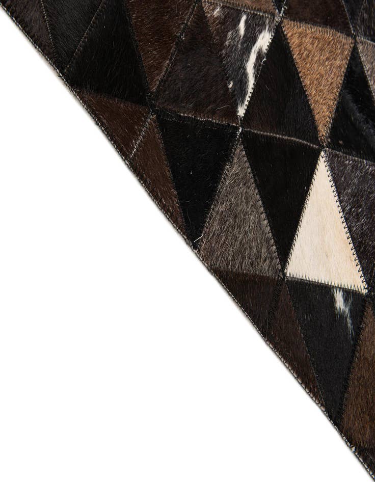 Detail image of  5' x 7' 11 Cowhide Stocks Rug