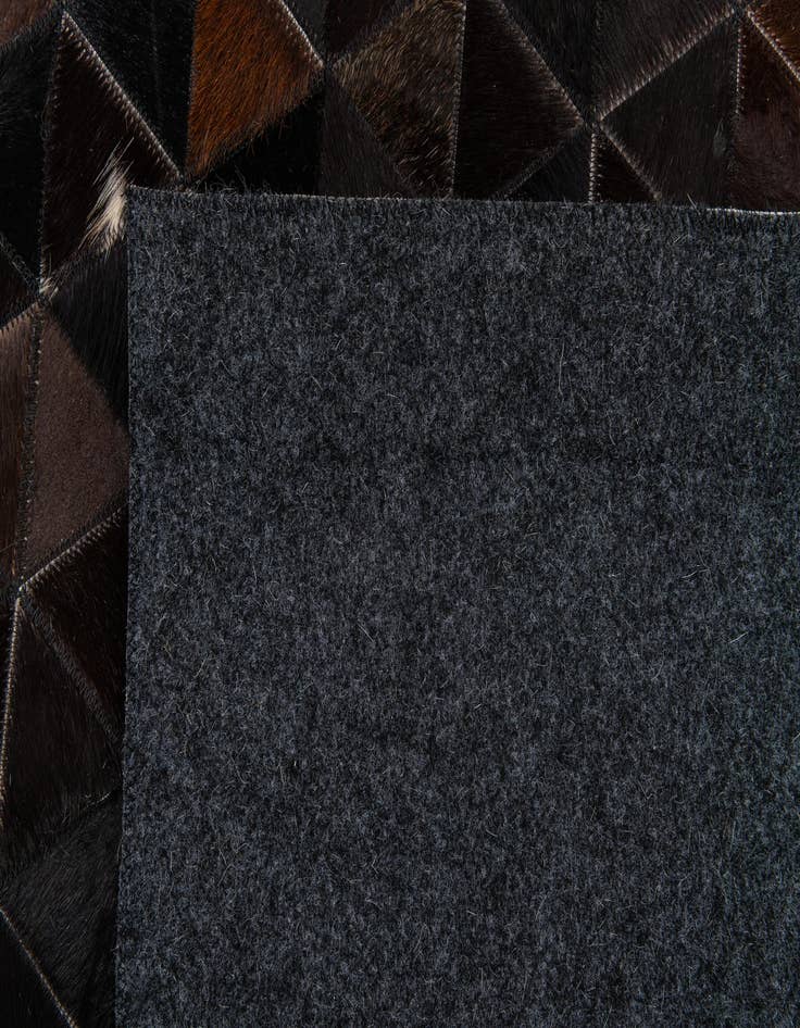 Detail image of  5' 1 x 8' Cowhide Stocks Rug