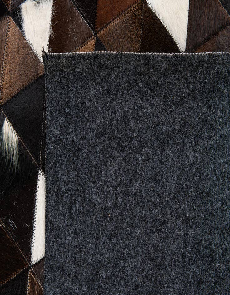 Detail image of  4' 11 x 7' 10 Cowhide Stocks Rug