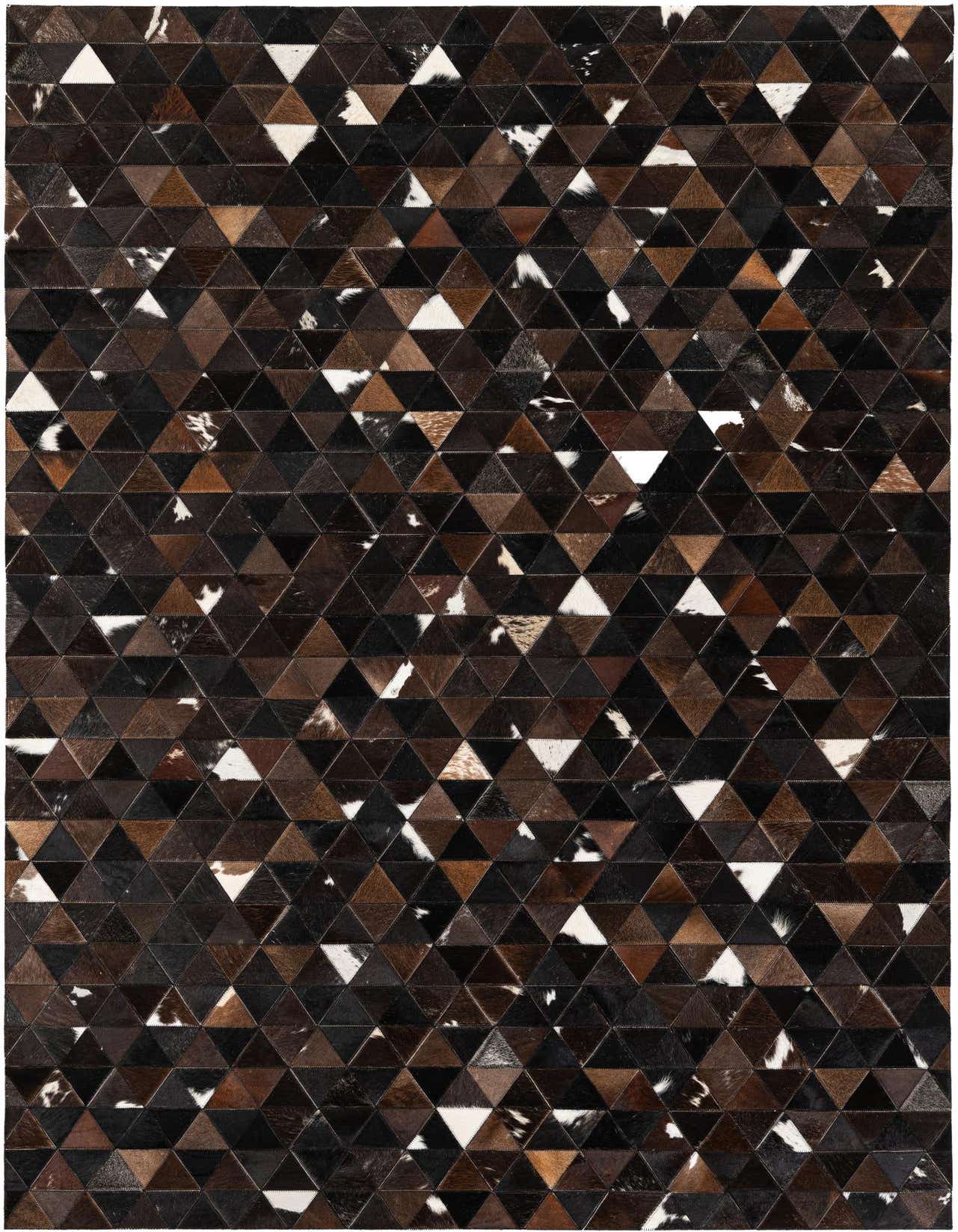 A 5x8 rectangular Cowhide Stocks rug featuring a geometric patchwork of brown, tan, black, and white cowhide triangles.