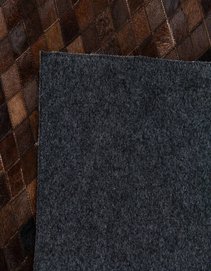 Detail image of  5' 1 x 7' 11 Cowhide Stocks Rug