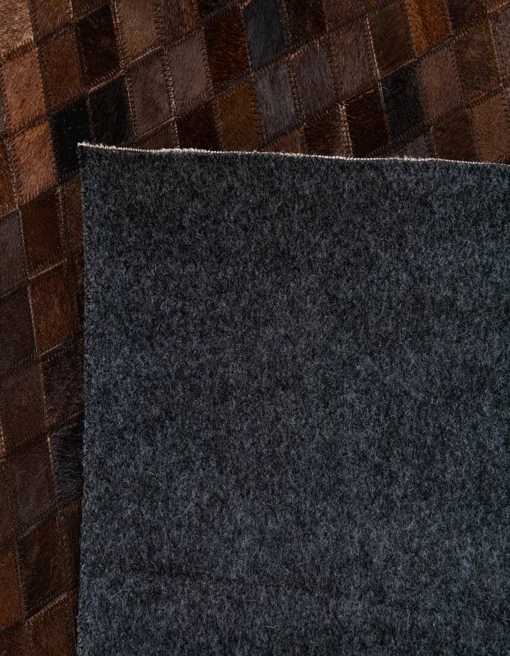 Detail image of  5' 1 x 7' 11 Cowhide Stocks Rug