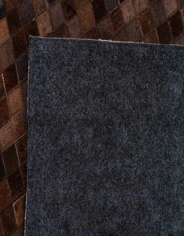 Detail image of  5' 2 x 8' Cowhide Stocks Rug