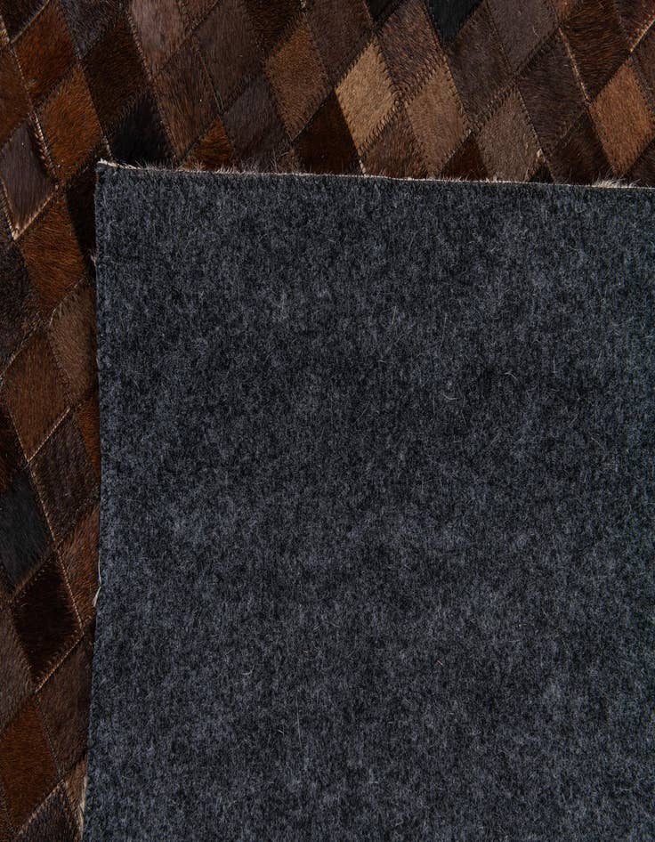Detail image of  5' 2 x 8' Cowhide Stocks Rug