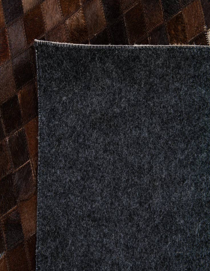 Detail image of  5' 1 x 8' 2 Cowhide Stocks Rug