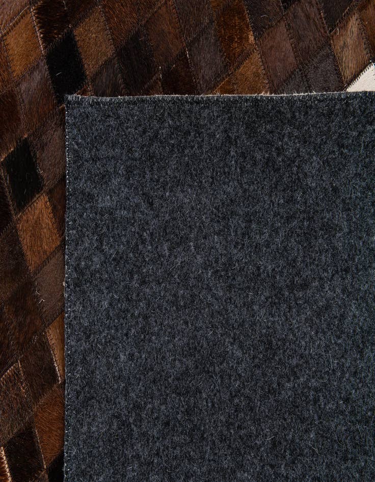 Detail image of  5' 2 x 8' 1 Cowhide Stocks Rug