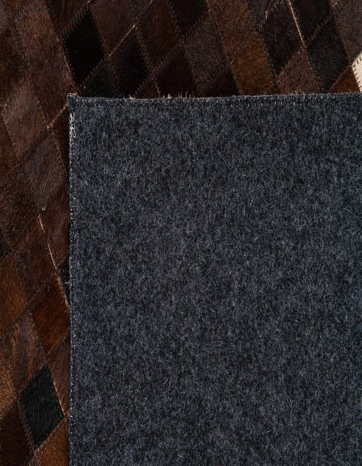 Detail image of  5' 2 x 8' 1 Cowhide Stocks Rug