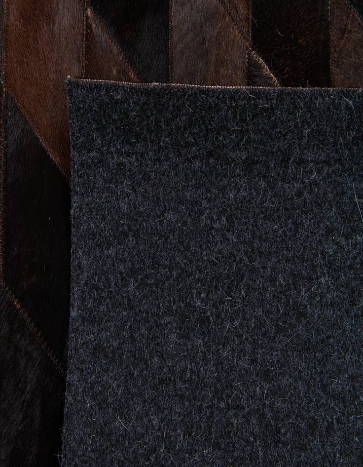 Detail image of  5' 2 x 8' Cowhide Stocks Rug