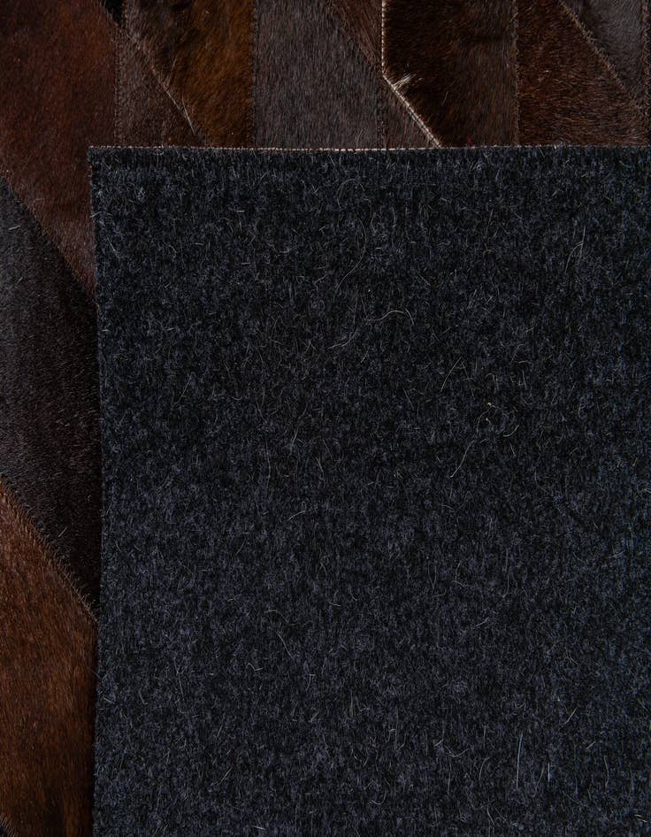 Detail image of  5' 2 x 8' Cowhide Stocks Rug