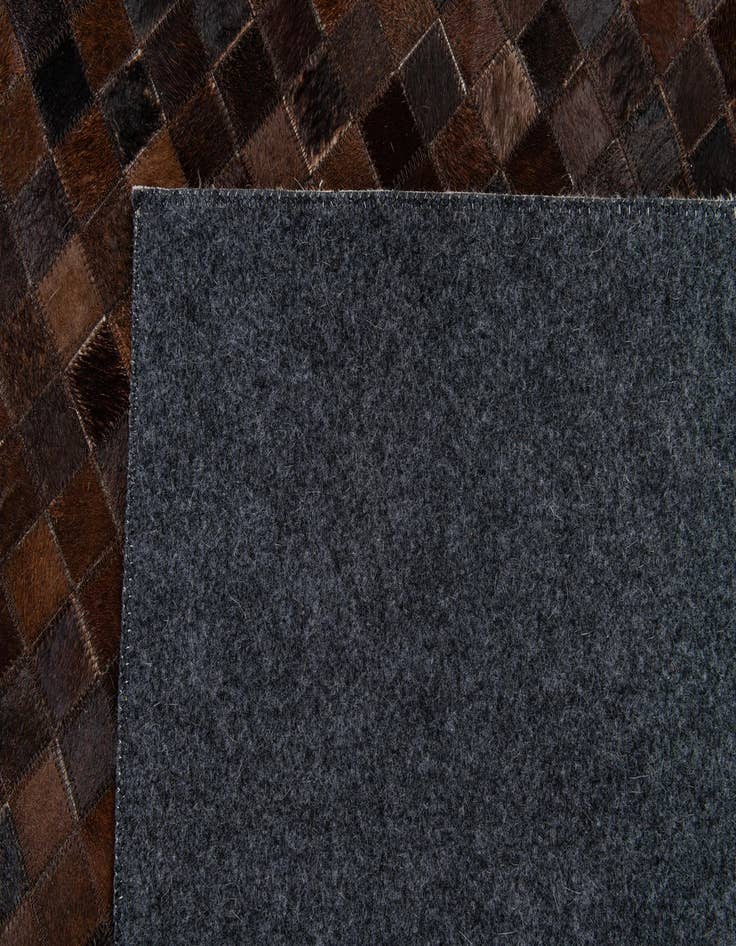 Detail image of  5' 3 x 8' Cowhide Stocks Rug