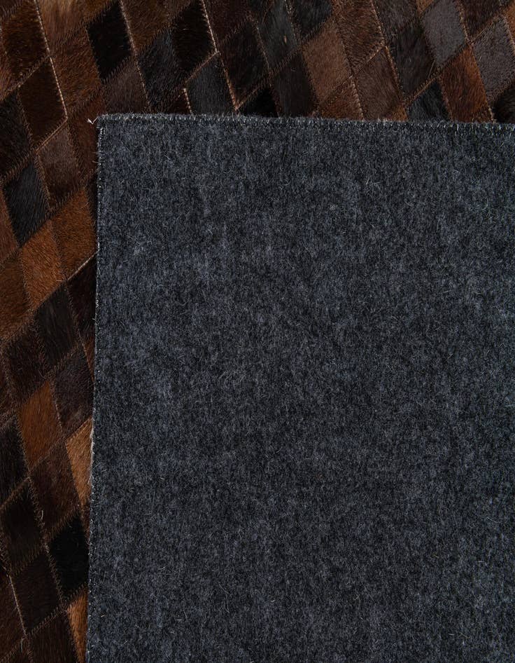 Detail image of  5' 2 x 8' Cowhide Stocks Rug