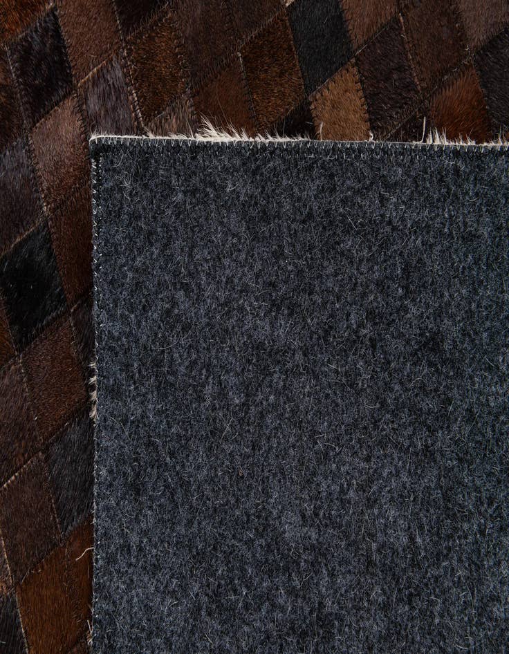 Detail image of  5' x 7' 11 Cowhide Stocks Rug