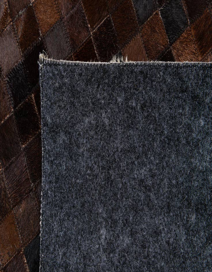 Detail image of  5' 1 x 7' 11 Cowhide Stocks Rug
