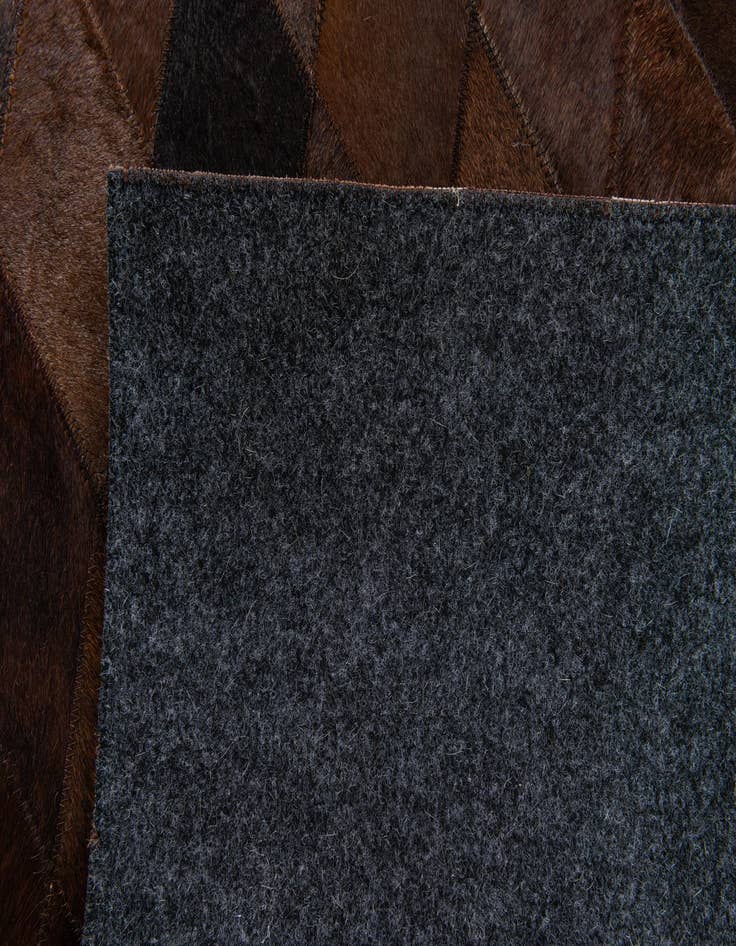 Detail image of  5' 7 x 7' 11 Cowhide Stocks Rug