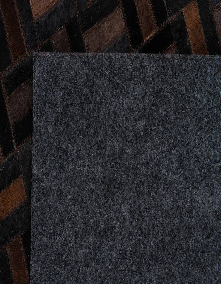 Detail image of  4' 11 x 7' 11 Cowhide Stocks Rug