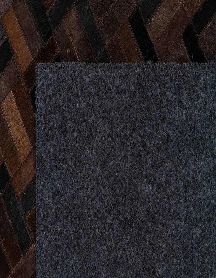 Detail image of  5' x 7' 11 Cowhide Stocks Rug