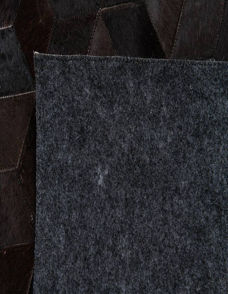 Detail image of  5' 2 x 8' Cowhide Stocks Rug
