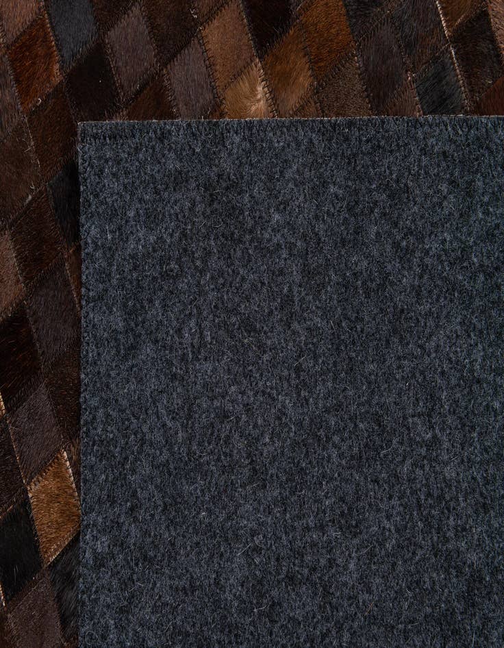 Detail image of  5' 1 x 8' Cowhide Stocks Rug