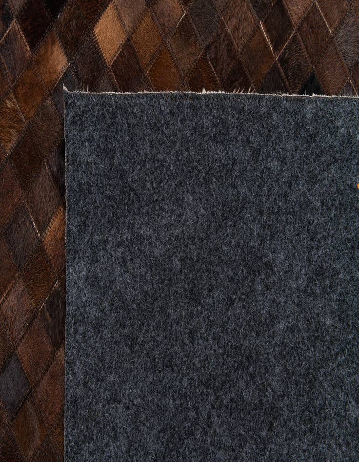 Detail image of  5' 1 x 8' 3 Cowhide Stocks Rug