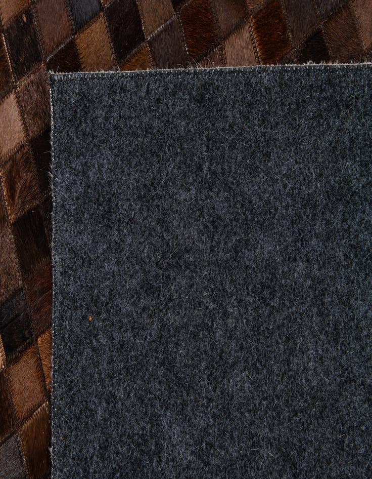 Detail image of  5' x 7' 11 Cowhide Stocks Rug