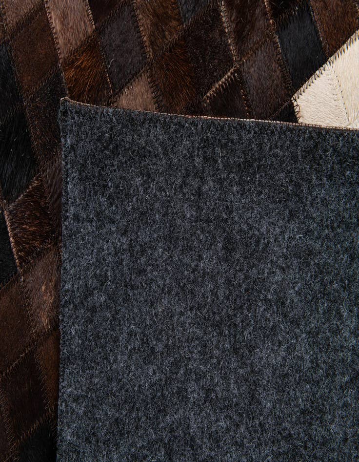 Detail image of  5' 1 x 8' Cowhide Stocks Rug