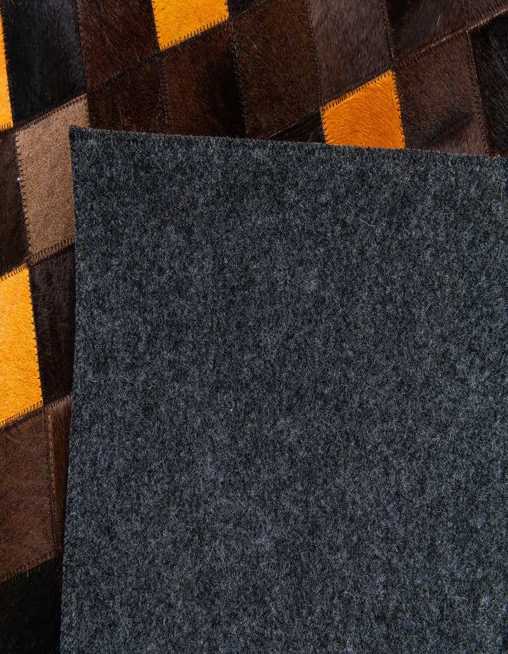 Detail image of  5' 2 x 8' Cowhide Stocks Rug