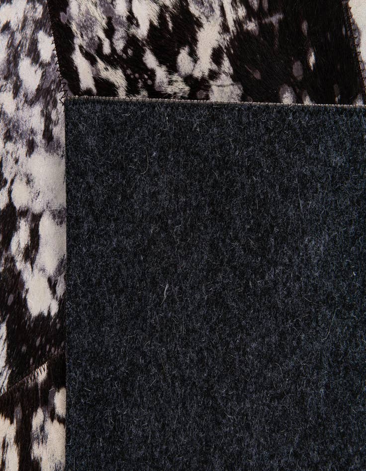 Detail image of  5' 2 x 8' Cowhide Stocks Rug