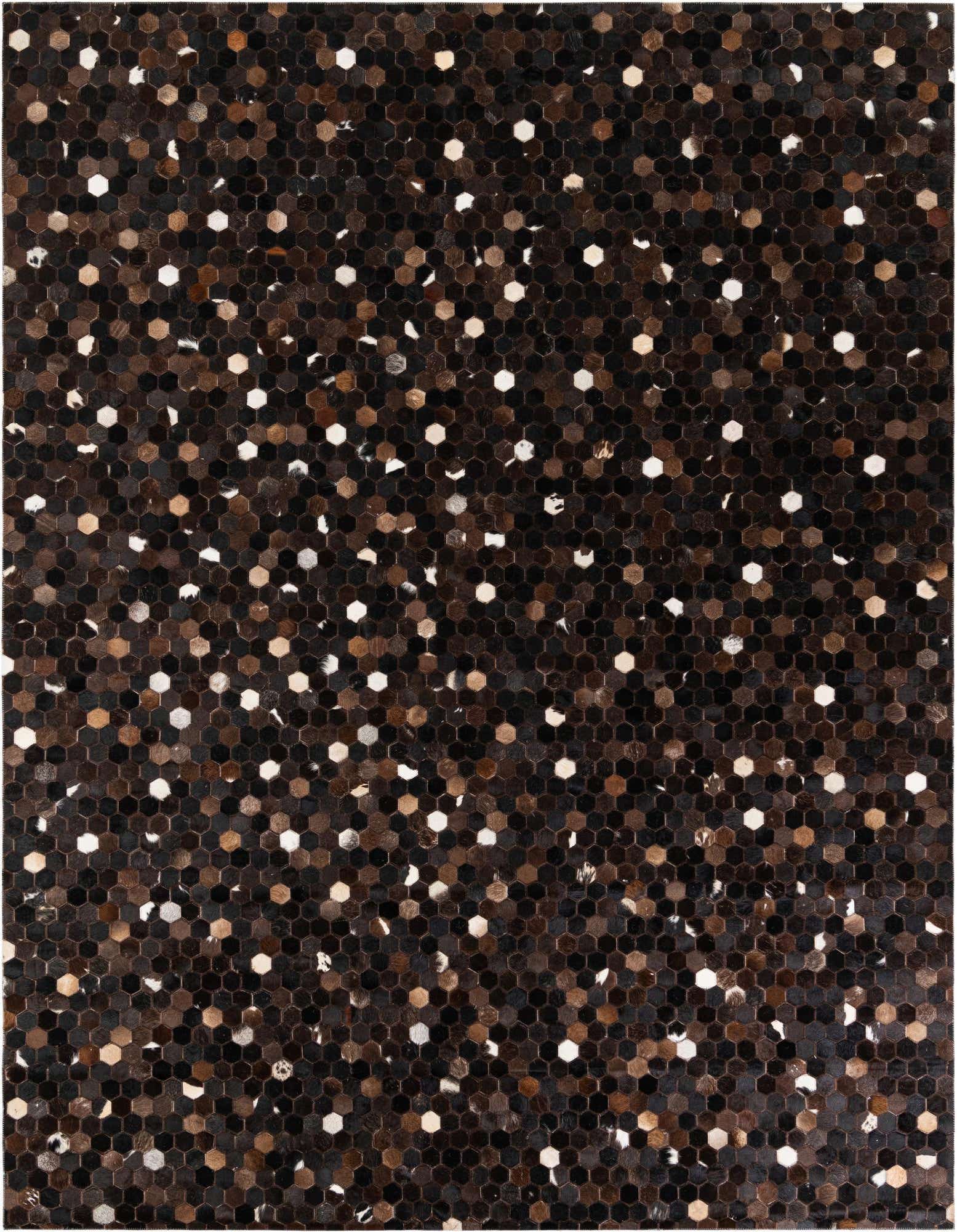 A rectangular 8x10 modern cowhide rug featuring a mosaic of small hexagonal patches in varying shades of brown, tan, and black, with scattered white accents.
