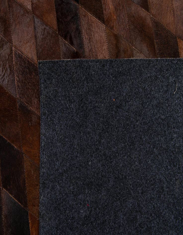 Detail image of  6' 7 x 9' 10 Cowhide Stocks Rug