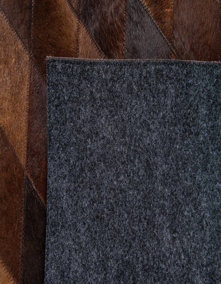 Detail image of  4' 8 x 6' 6 Cowhide Stocks Rug