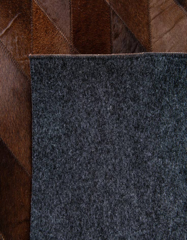 Detail image of  4' 8 x 6' 6 Cowhide Stocks Rug