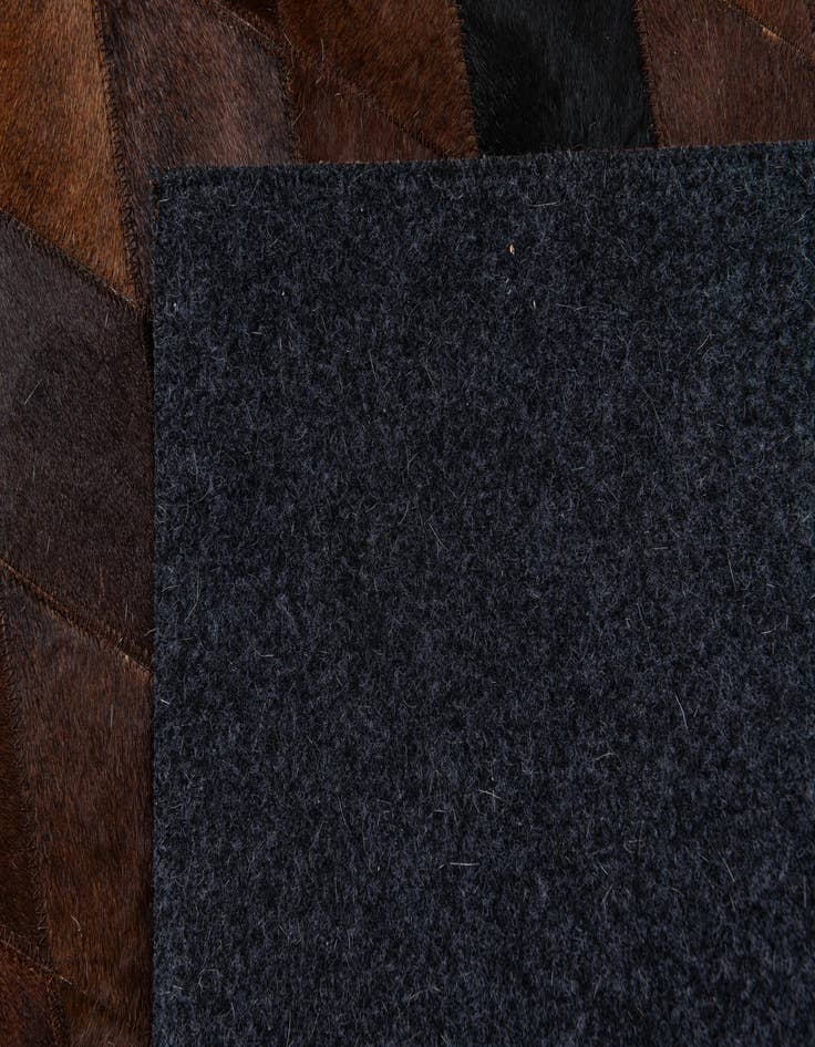 Detail image of  4' 8 x 6' 9 Cowhide Stocks Rug