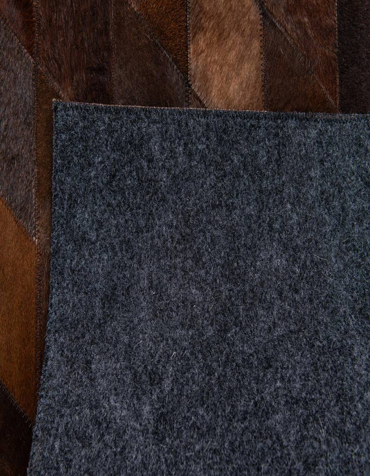 Detail image of  4' 1 x 5' 10 Cowhide Stocks Rug