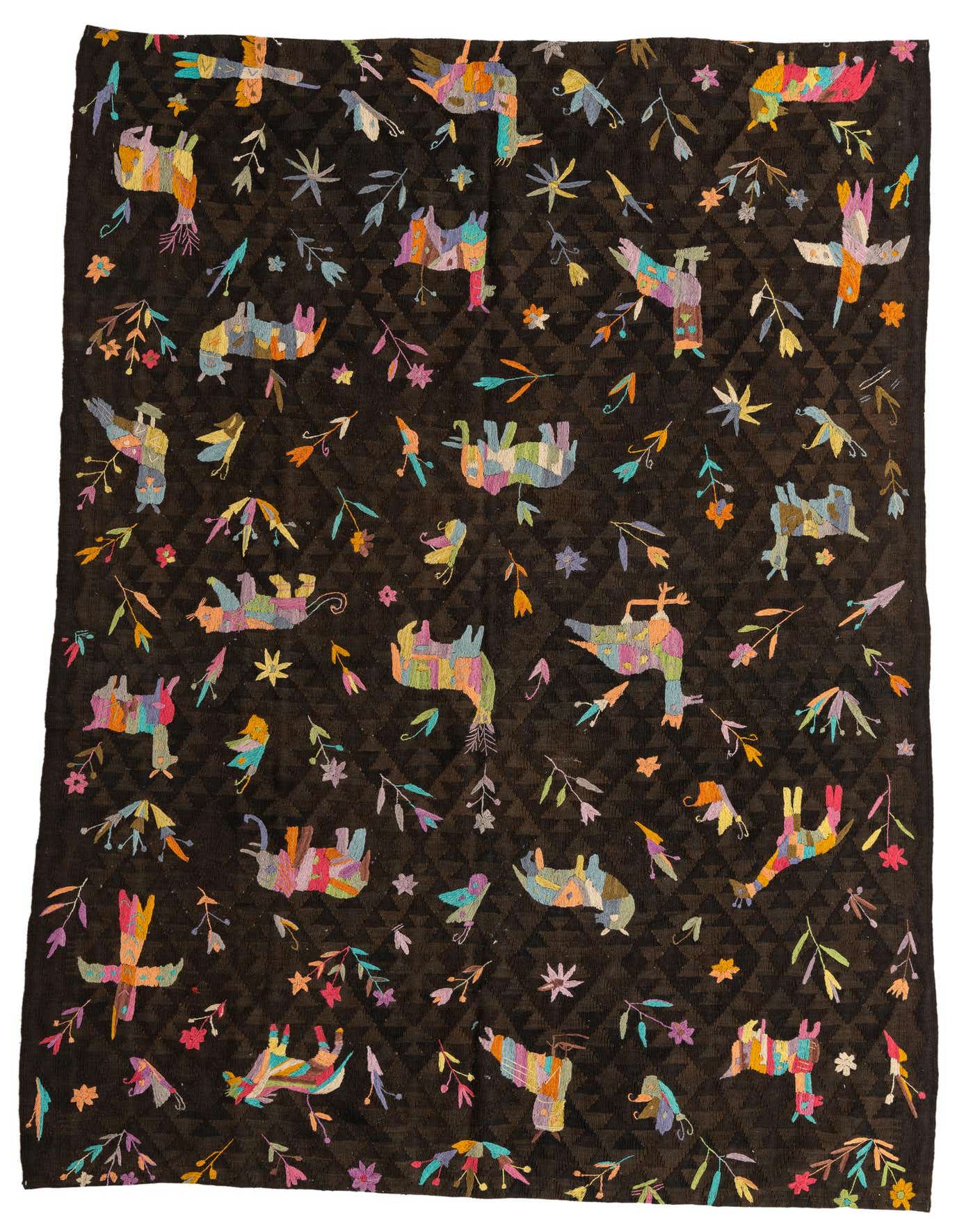 A 6x9 rectangular brown Kilim Suzani rug with colorful tribal animal and floral patterns, ideal for a living room.