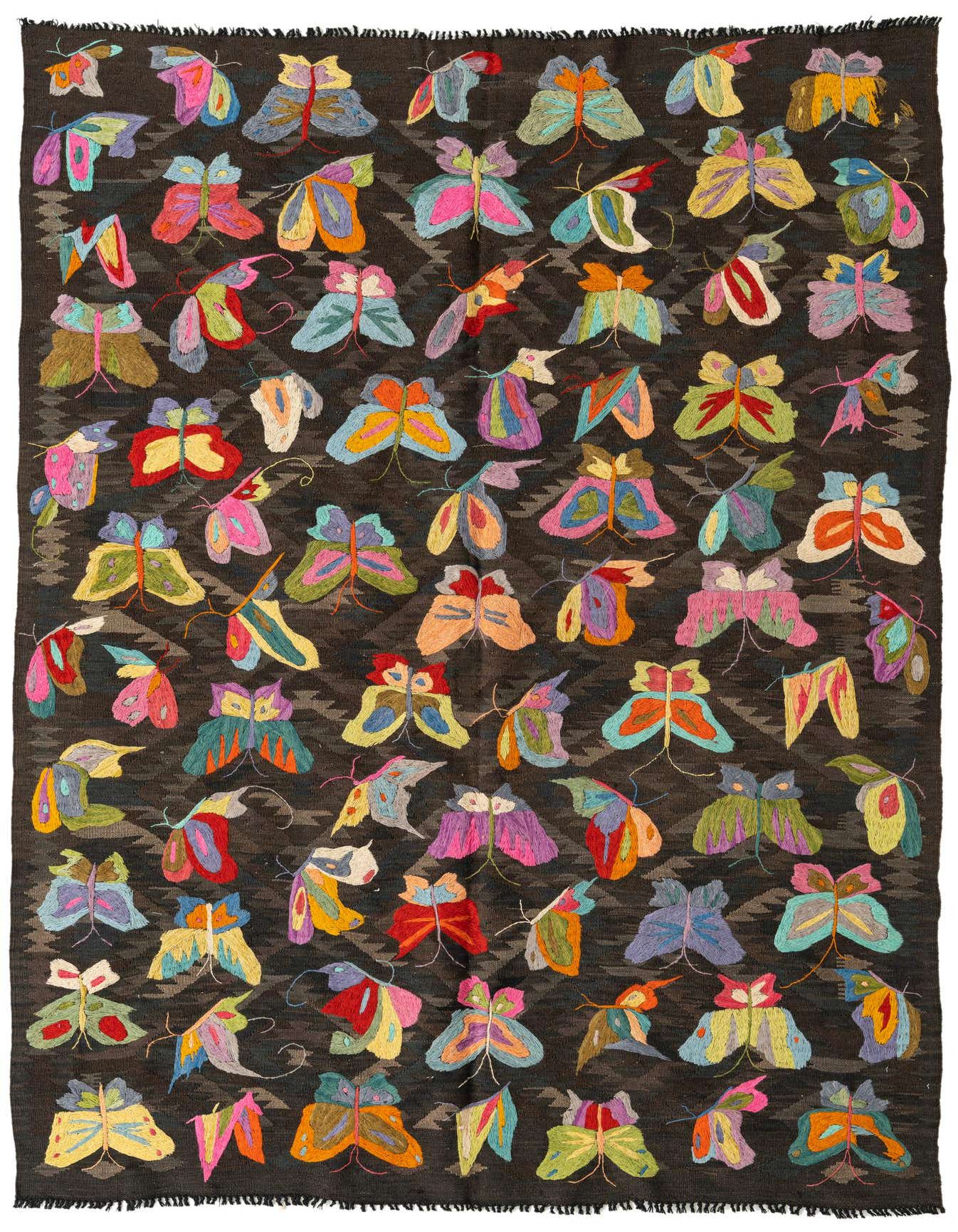 A 5x8 rectangular brown Kilim Suzani rug with vibrant, multicolored butterfly and moth patterns, ideal for an indoor living space.