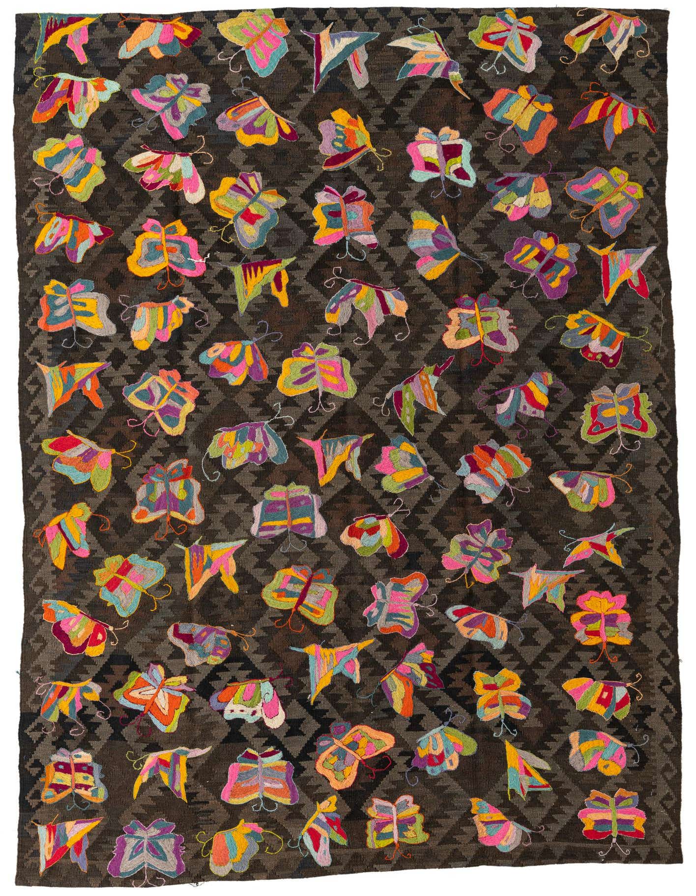 A 6x9 rectangular Kilim Suzani rug featuring a dark brown tribal pattern background with colorful embroidered butterflies.