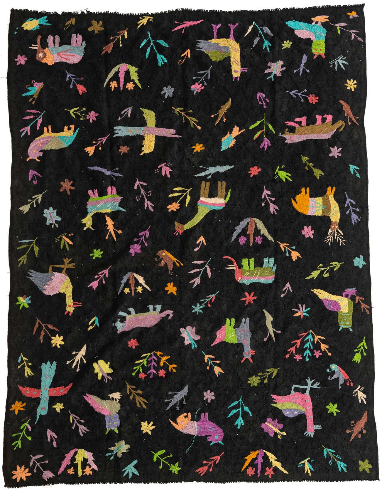 A 6x9 rectangular Kilim Suzani rug features a black background with colorful embroidered tribal animal and plant motifs.