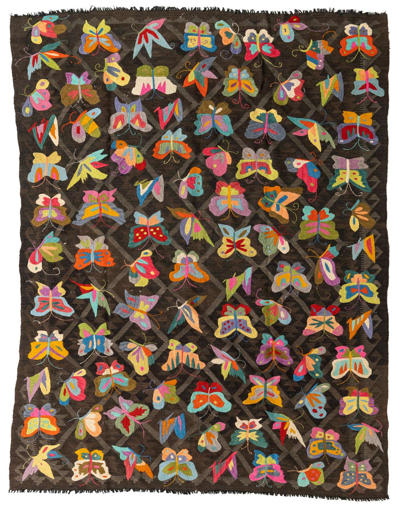 A 6x9 rectangular Kilim Suzani rug features a dark brown background with a subtle diamond pattern, covered in numerous colorful, embroidered butterfly motifs in various hues.