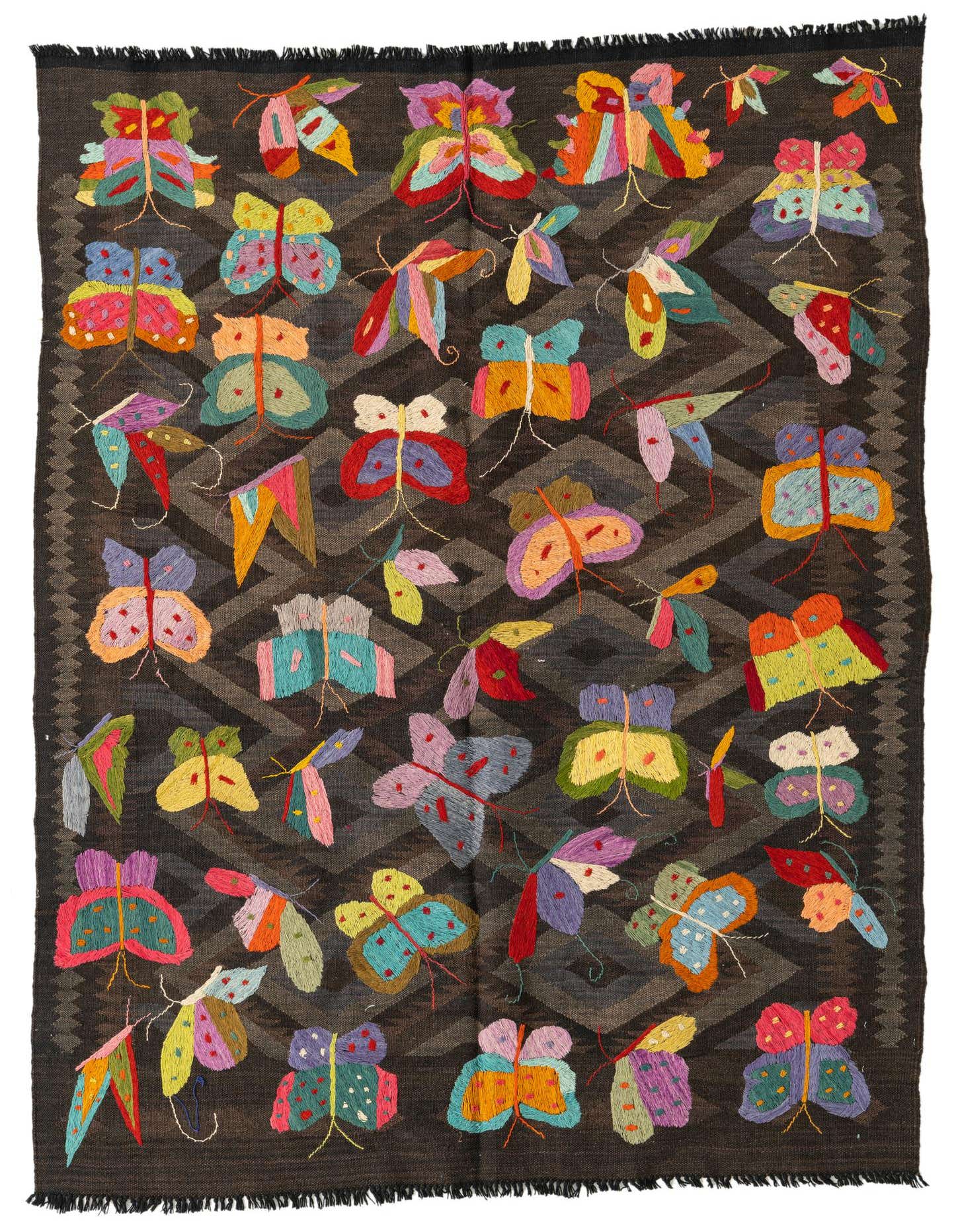 A 4x6 rectangular brown Kilim Suzani rug with a tribal geometric pattern and colorful embroidered butterflies.