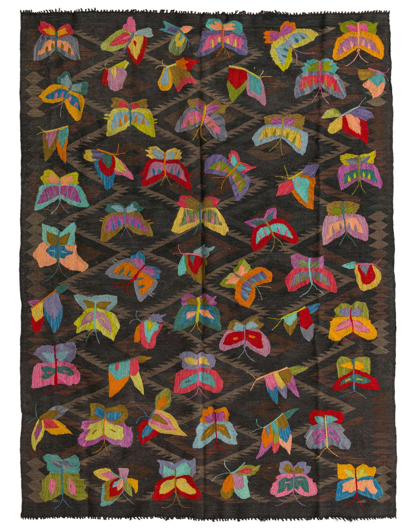 A 5x8 rectangular Kilim Suzani rug featuring a dark brown background with a subtle geometric pattern, adorned with numerous colorful, embroidered butterfly motifs in various hues like pink, green, blue, yellow, and orange, suitable for a living room.