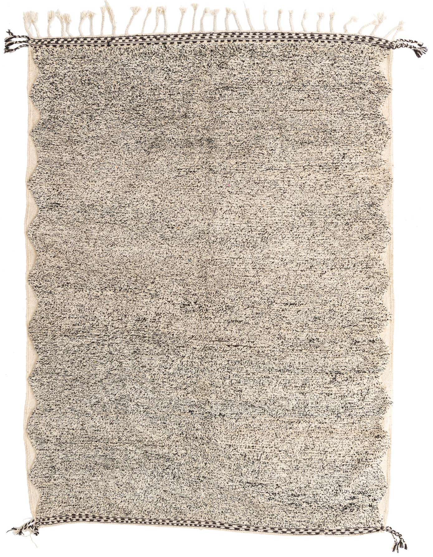 A rectangular 7x10 Moroccan shag rug featuring a tribal pattern in browns and tans, with fringe.