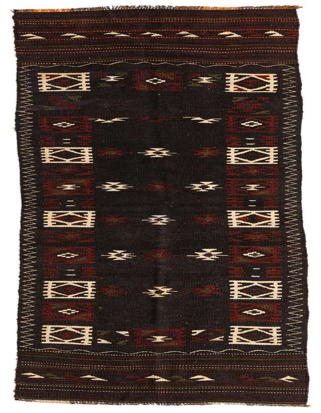 A long, narrow 11 ft runner rug featuring a dark brown field with tribal geometric patterns in tan, deep red, and olive green, ideal for a hallway.