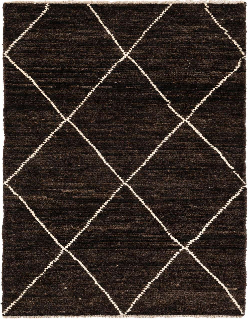A 6 ft runner rug with a shag pile, featuring a dark brown background and a white tribal diamond pattern.