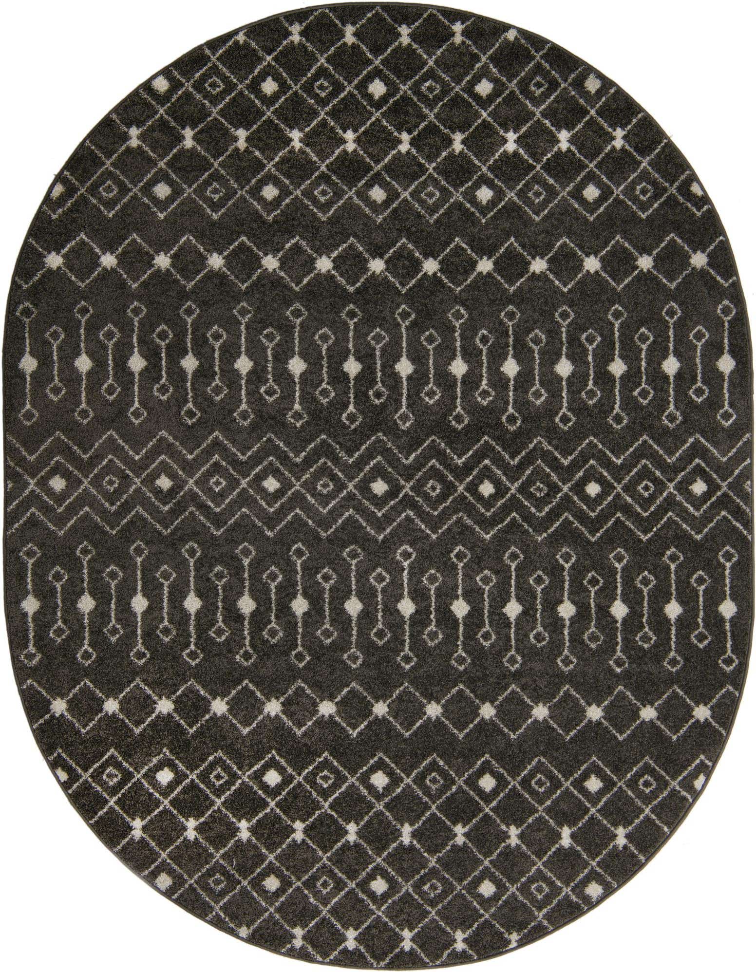 An oval gray polypropylene rug with a distressed white bohemian trellis pattern, suitable for indoor spaces.