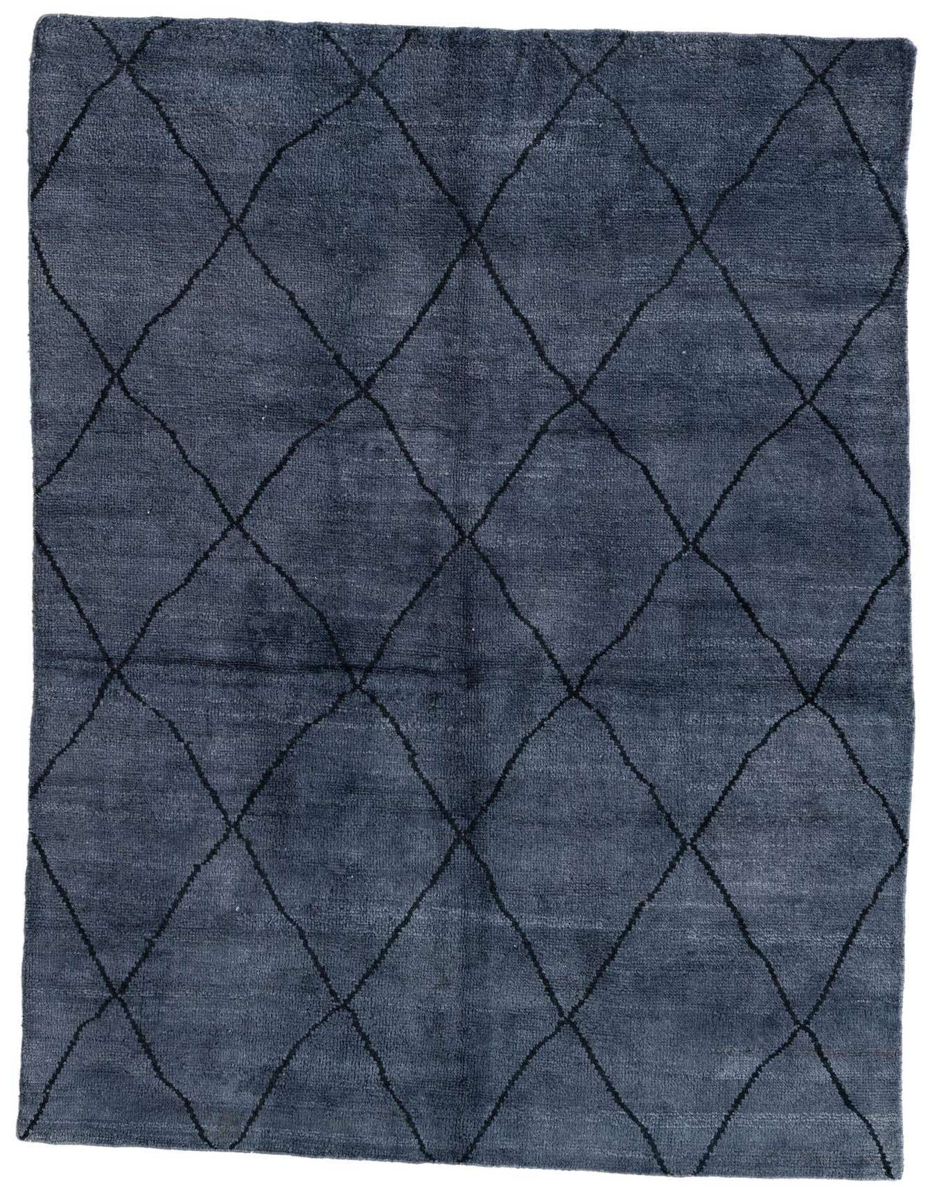A 6x9 rectangular gray shag rug with a modern tribal diamond pattern, ideal for a living room or bedroom.