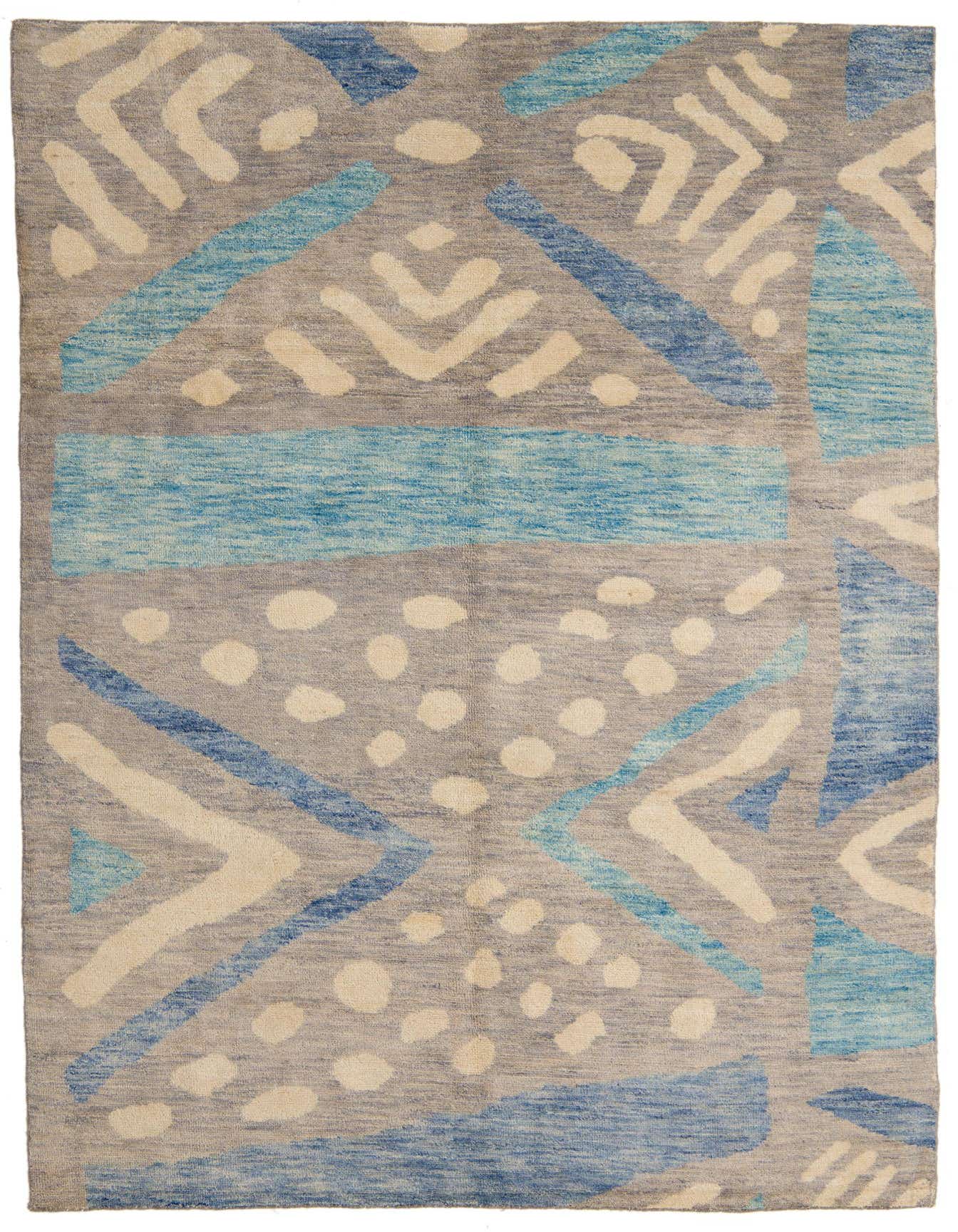 A 7x10 rectangular gray wool shag rug with a modern tribal pattern in shades of blue and cream.